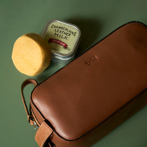 Tusk 770 Italian leather toiletry bag in Wood, shown with Chamberlain’s Leather Milk and sponge — premium leather care essentials for maintaining durability and patina - WOOD