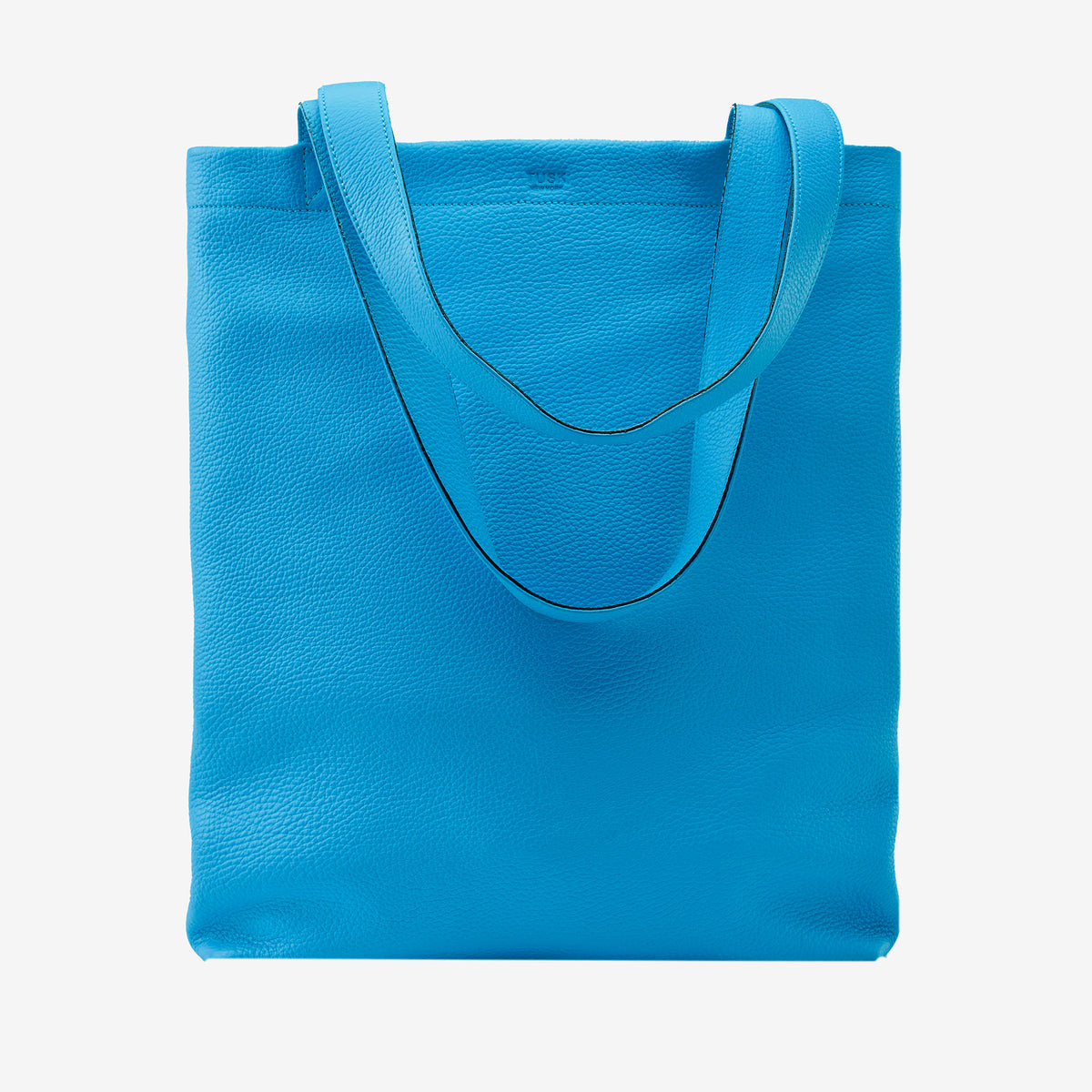 Blue italian leather tote bag on a light gray background - AZURE