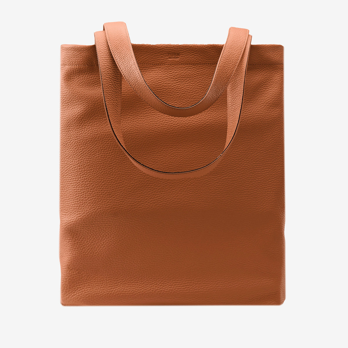 Brown leather tote bag on a white background - TOAST