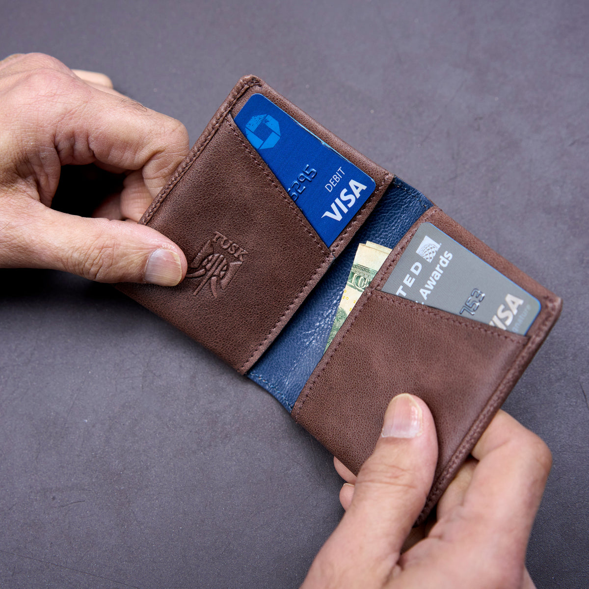 Brown leather wallet with cards on a gray background - BROWN