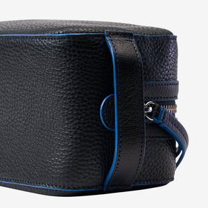Tusk Ascot Toiletry Case in black Italian leather featuring textured grain, blue edge paint detailing, and premium zipper closure - BLACK