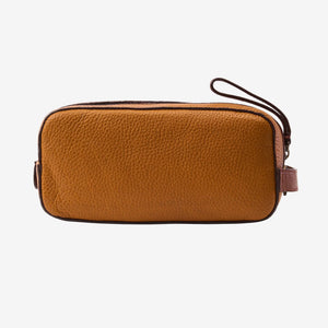 Tan leather toiletry case with a zipper on a white background - TAN