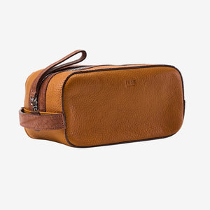 Tan leather toiletry bag with zipper on a white background - TAN