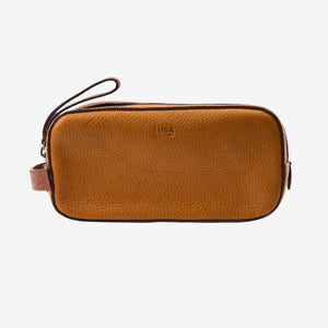 Tan  leather toiletry with dark accents on a white background - TAN