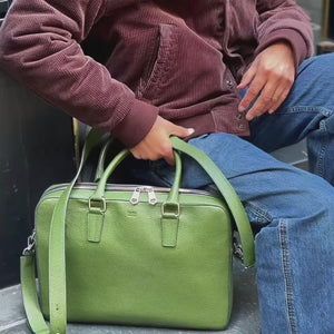 Man walking in the city with green leather briefcase (video) - FOREST 