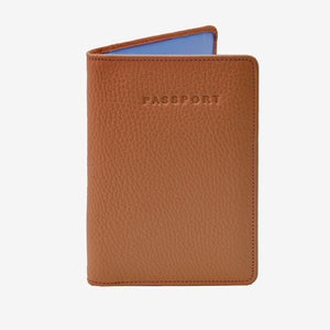 Brown passport holder with 'PASSPORT' text on a white background - TOAST