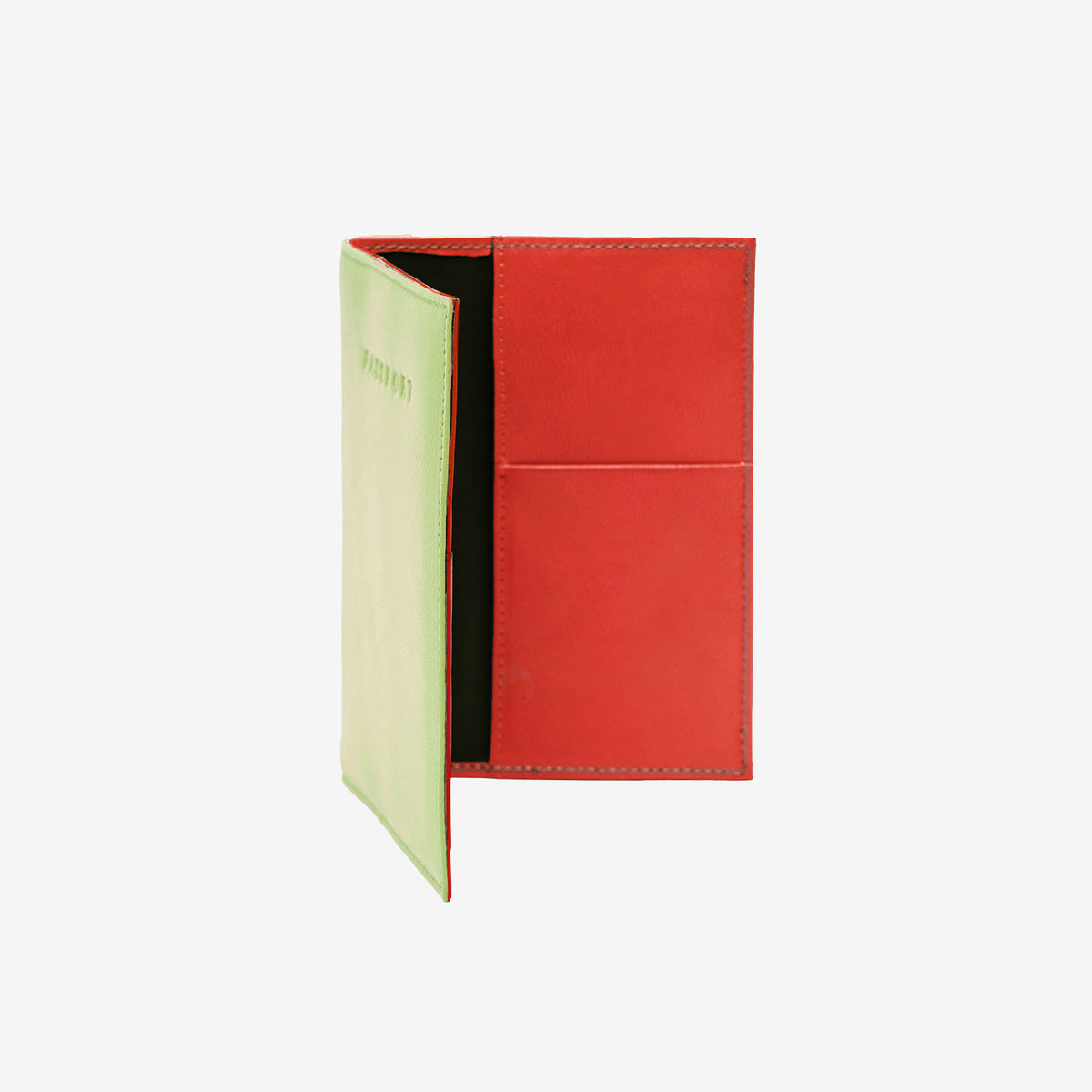 An open leather passport cover standing upright against a white background. The exterior left side is a vibrant lime green with 'PASSPORT' subtly embossed on the front, while the interior right side features a contrasting bright orange leather pocket panel with two card slots and visible stitching along the edges. - LIME/ORANGE
