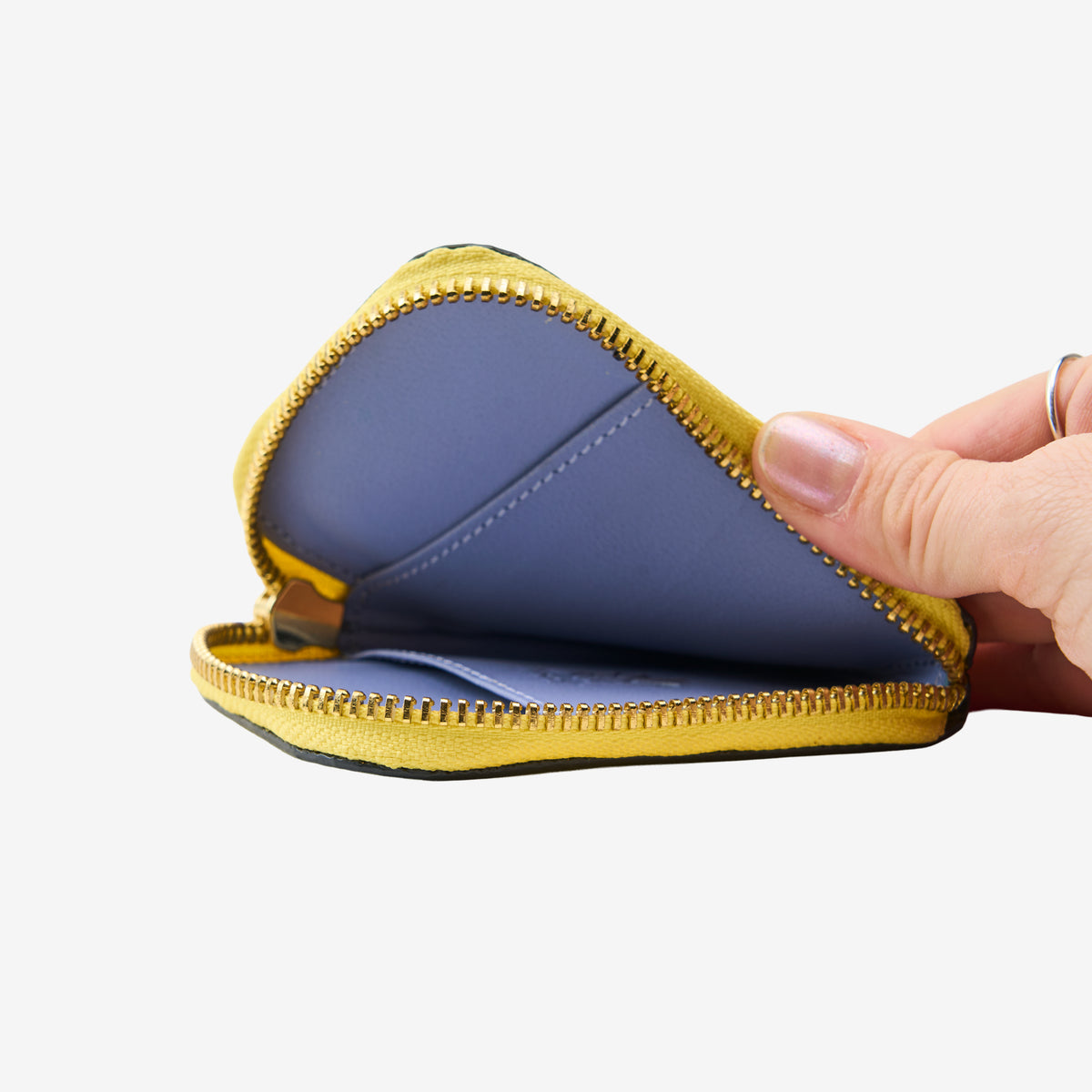 Tusk 194 Ascot small zip card wallet, open and held in hand - LIME