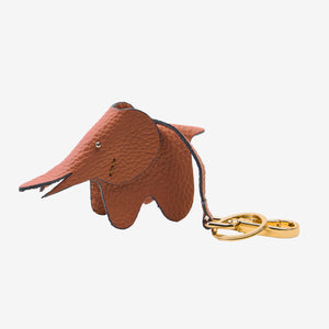 Brown elephant-shaped keychain on a white background - TOAST