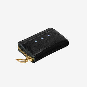 Tusk 322 Ascot Coin and Card Case in black Italian pebble-grain cowhide leather. Angled top view showing leather texture and gold zipper - BLACK