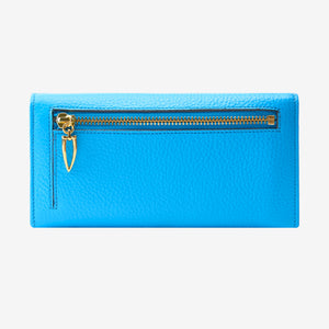 Tusk Ascot Flap Over Leather Wallet in Azure Blue showing the back exterior zipper pocket and gold-tone artisan hardware - AZURE