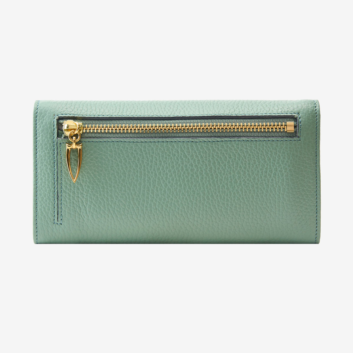 Back view of the Ascot flap-over wallet in sage green pebbled leather, displaying the exterior zipper compartment with a gold-tone zipper and a distinct triangular pull tab against a light gray background - SAGE