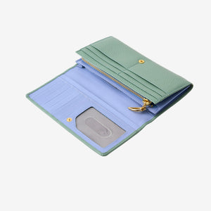 Tusk Ascot Flap Over Leather Wallet in Sage Green shown open to reveal a light blue contrast leather interior with card slots and premium artisan hardware - SAGE