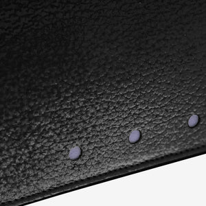Tusk 376 Ascot Flap Over Wallet in black Italian pebble-grain cowhide leather. Close-up of the photographed pebble-grain leather and matching stitching - BLACK