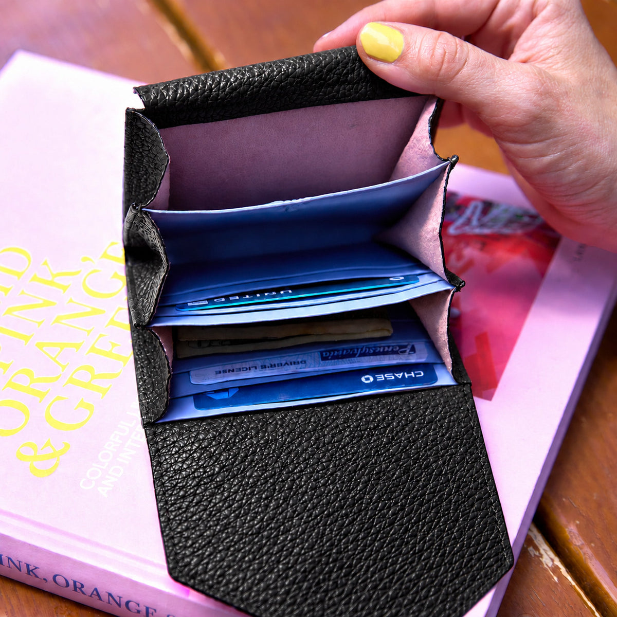 Tusk 382 Ascot Origami Wallet in black Italian pebble-grain cowhide leather. Wallet held open with a matching pebble-grain leather flap and original lavender-blue dividers - BLACK