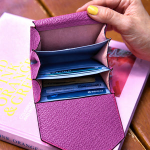 Tusk 382 Ascot Origami Wallet in magenta Italian pebble-grain cowhide leather. Wallet held open with a matching pebble-grain leather flap and original lavender-blue dividers - MAGENTA