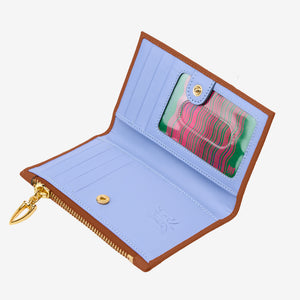 Tusk 383 Ascot Slim Card Case with Zip Coin Pocket in toast Italian pebble-grain cowhide leather. Open view showing the original blue interior and gold hardware - TOAST
