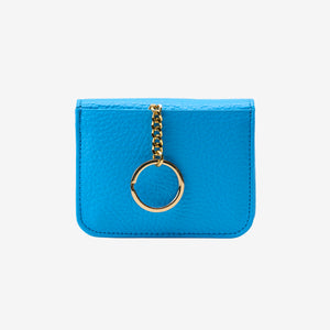 Blue cardholder with a gold ring and chain on a white background - AZURE