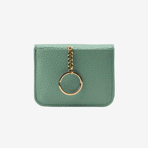 Green leather cardholder with a gold chain and ring on a white background - SAGE