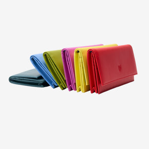 Tusk Lille leather clutch wallets arranged together – HUNTER GREEN, FRENCH BLUE, AVOCADO, MAGENTA, SUN and RED