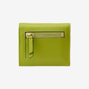 Tusk Lille gusseted French leather wallet in avocado green, shown from the back, highlighting the exterior zip pocket - AVOCADO