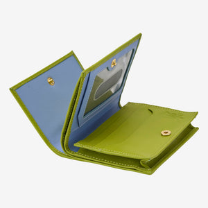 Tusk Lille gusseted French leather wallet in avocado green, opened to show its interior card slots and compartments - AVOCADO