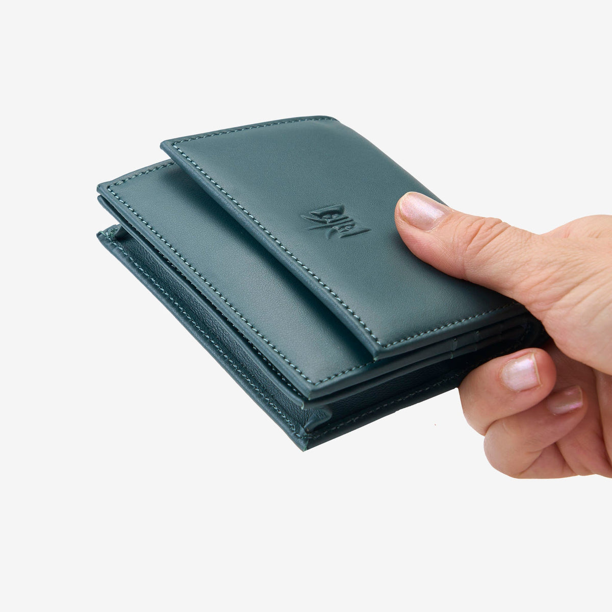 Tusk Lille gusseted French leather wallet in hunter green, held in hand to show its compact size, view two - HUNTER