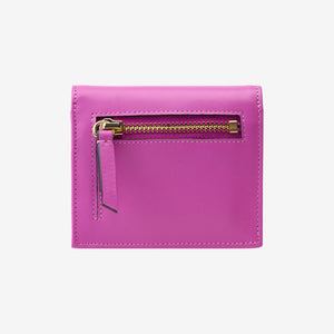 Tusk Lille gusseted French leather wallet in magenta, shown from the back, highlighting the exterior zip pocket - MAGENTA