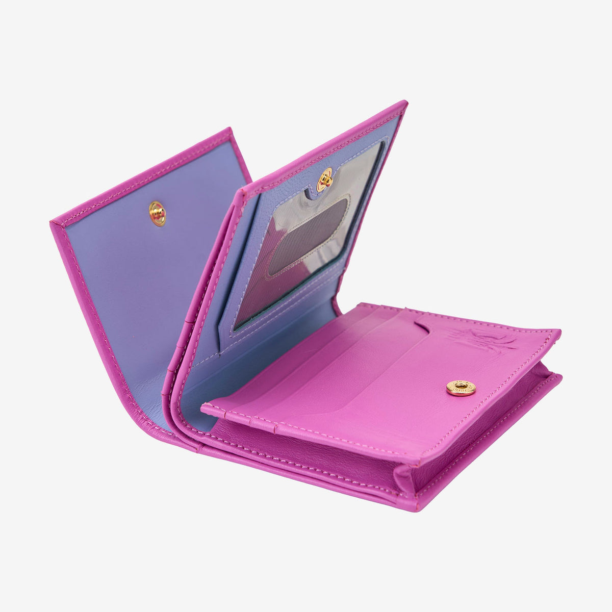 Tusk Lille gusseted French leather wallet in magenta, opened to show its interior card slots and compartments - MAGENTA