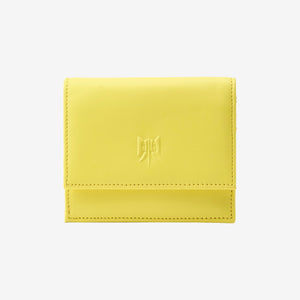 Tusk Lille gusseted French leather wallet in yellow Sun, closed, front view showing the flap closure - SUN