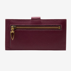 Maroon wallet with a gold zipper on a white background - OXBLOOD