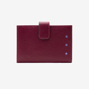 Burgundy leather wallet with a flap on a light gray background - OXBLOOD
