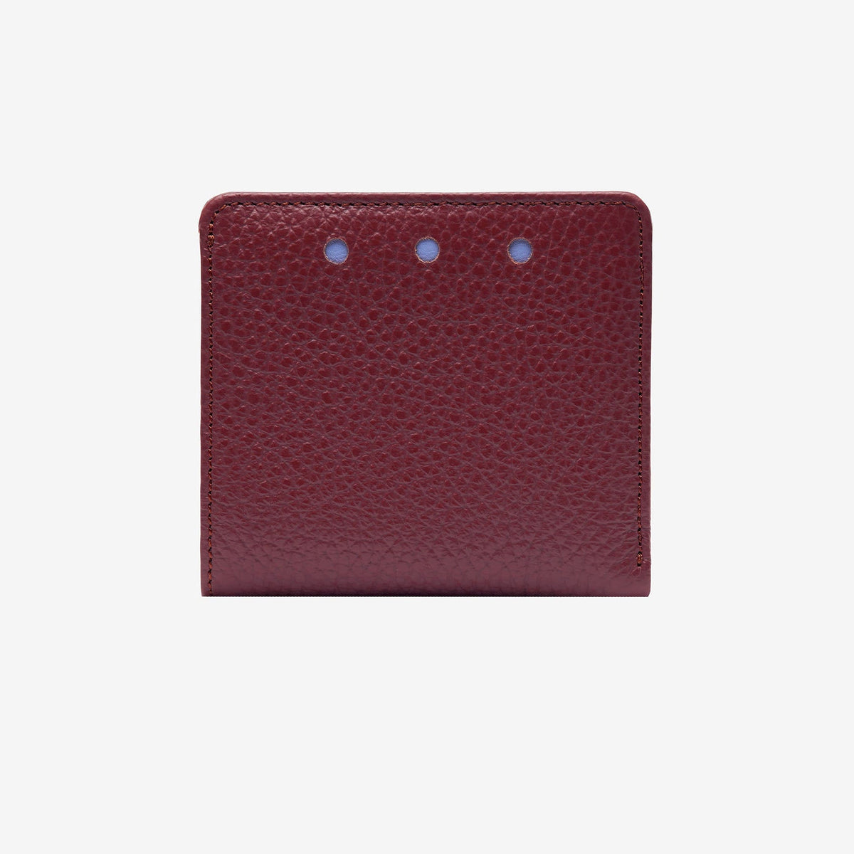 Maroon leather wallet with three small holes on a white background - OXBLOOD