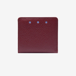 Maroon leather wallet with three small holes on a white background - OXBLOOD