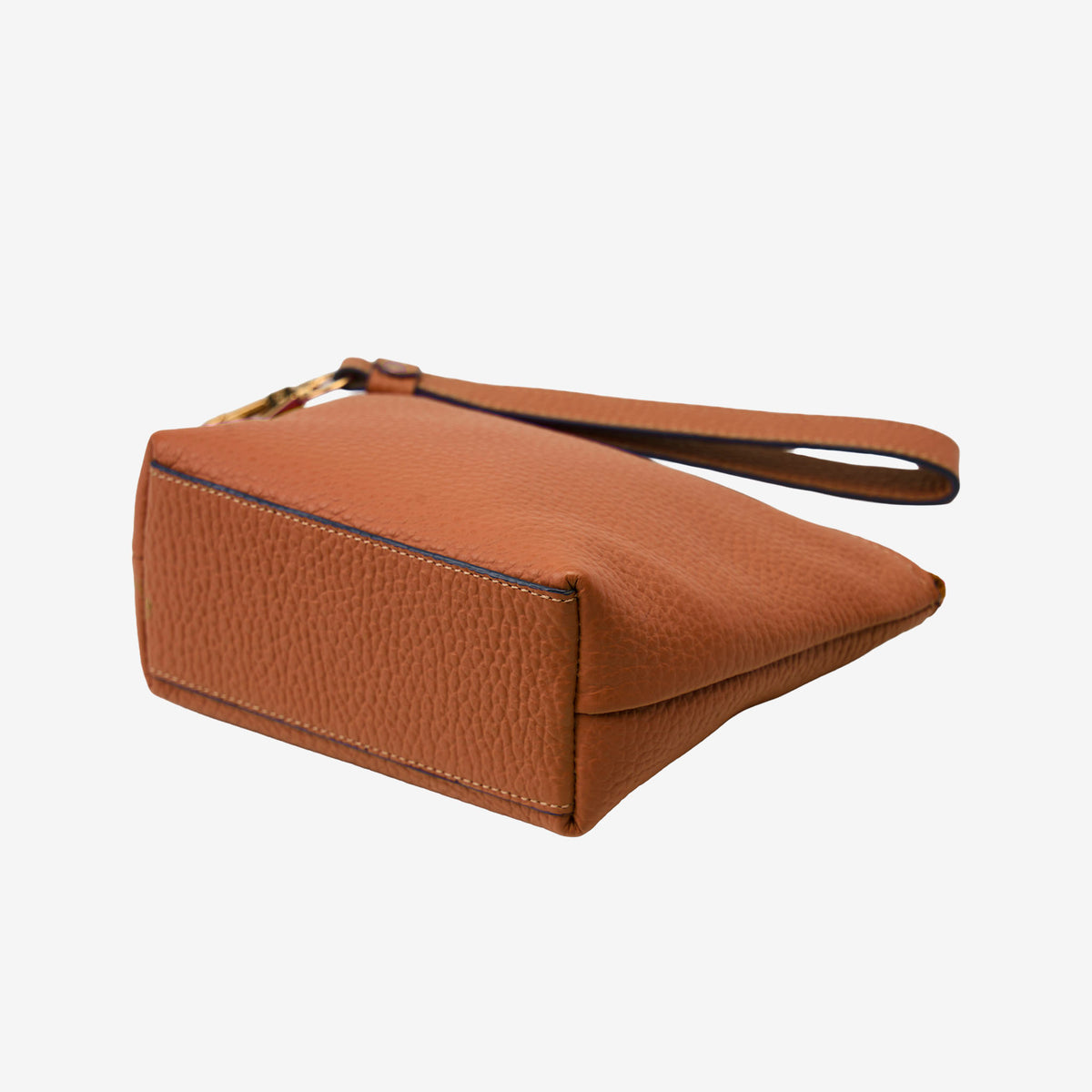 Brown leather cosmetic pouch on a white background - TOAST