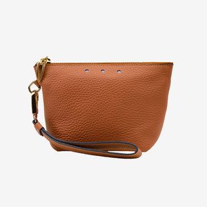 Brown leather cosmetic pouch with a strap on a white background - TOAST