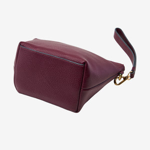 Maroon handbag with a strap on a white background - OXBLOOD