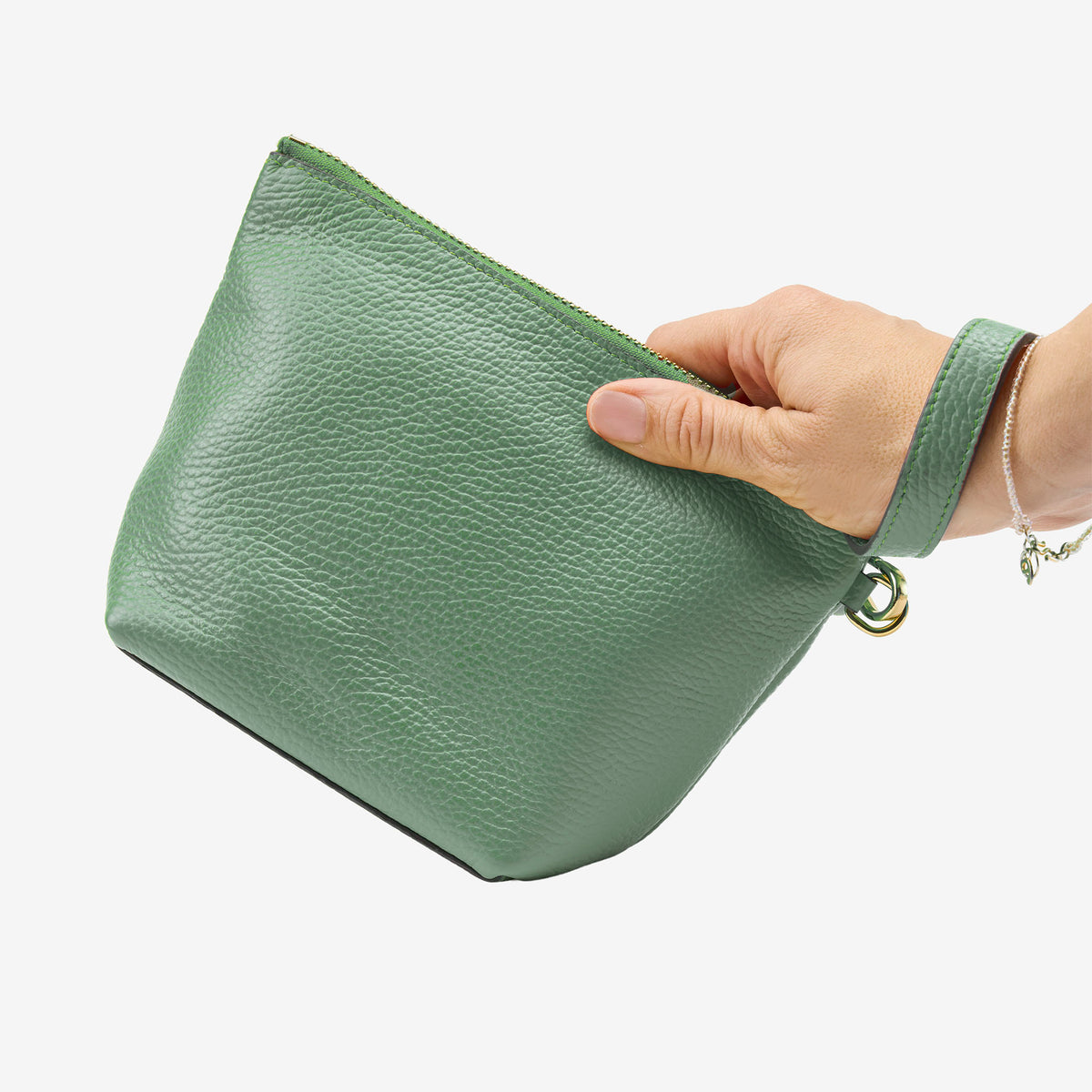Green pouch held by a hand on a white background - SAGE