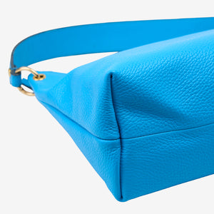 Blue leather handbag with a strap on a white background - AZURE
