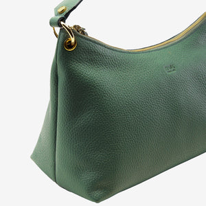 Close up of green handbag with gold zipper on a white background - FOREST