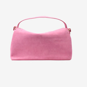 Pink suede handbag on a light pink background -BLUSH