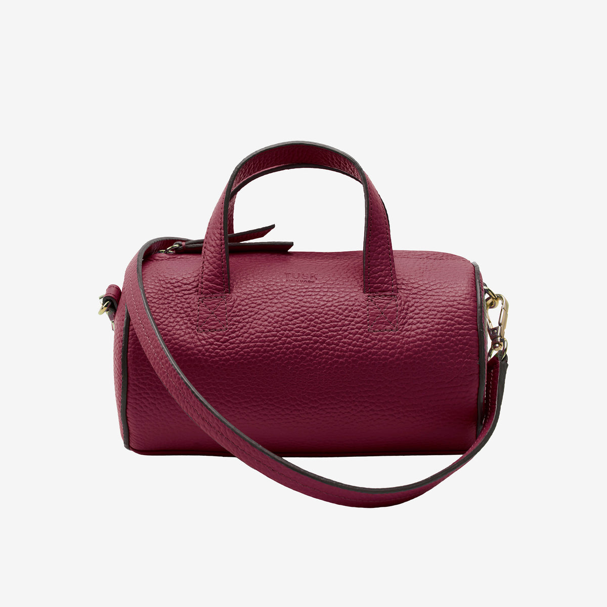Maroon barrel bag with a strap on a light gray background - OXBLOOD