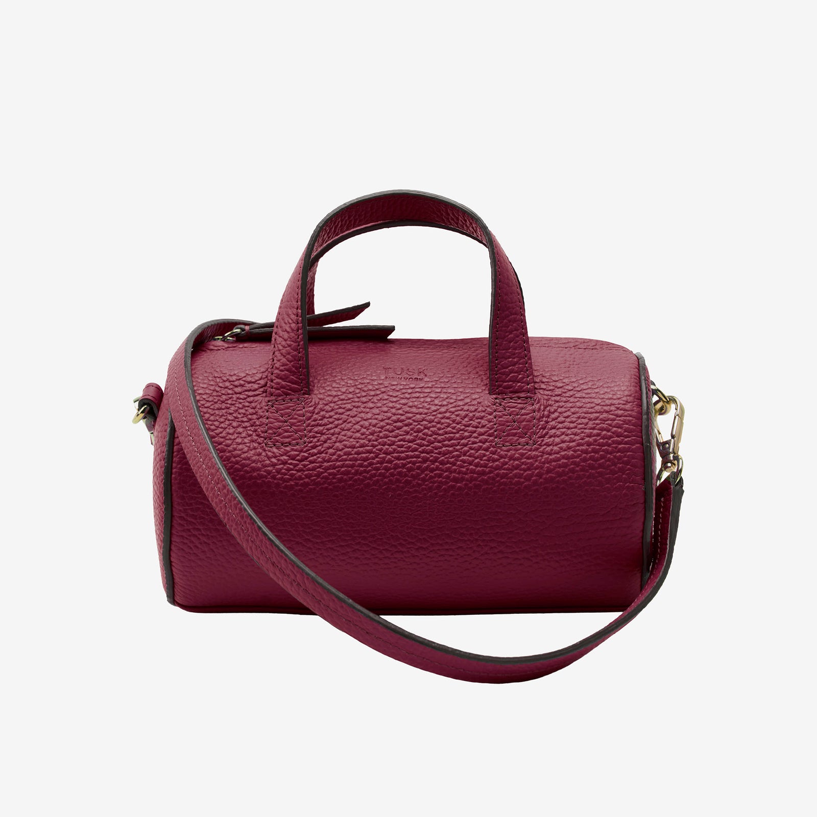 Maroon barrel bag with a strap on a light gray background - OXBLOOD