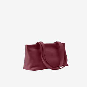 Tusk 9953 Anaya Zip Top Tote in Italian pebble-grain cowhide leather. Side view showing the leather shape and shoulder straps - OXBLOOD