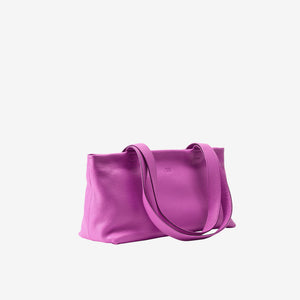 Side view of magenta leather tote bag showing soft structure and long straps - MAGENTA