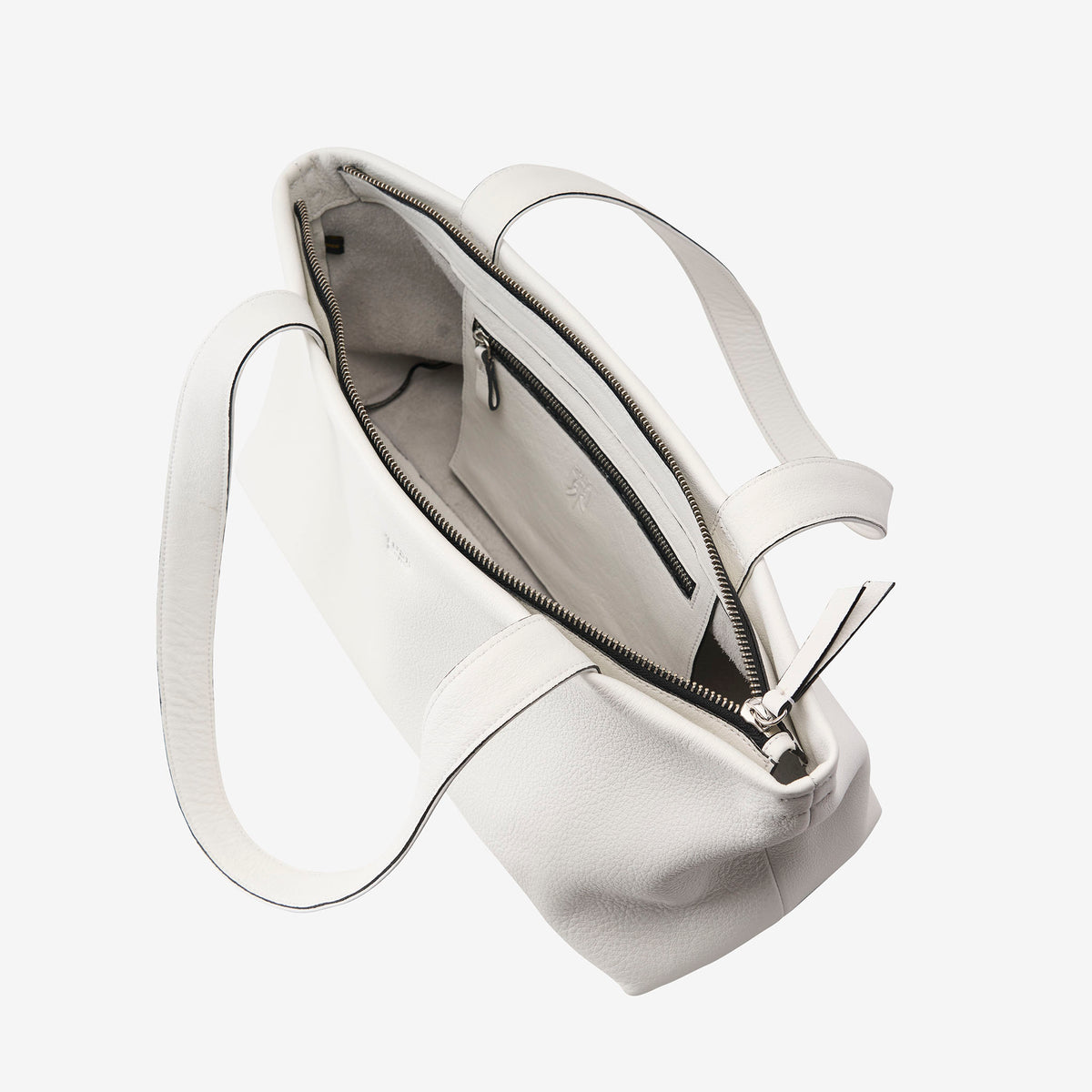 White leather zip-top tote bag open showing interior pocket and spacious compartment - WHITE