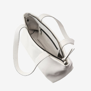 White leather zip-top tote bag open showing interior pocket and spacious compartment - WHITE