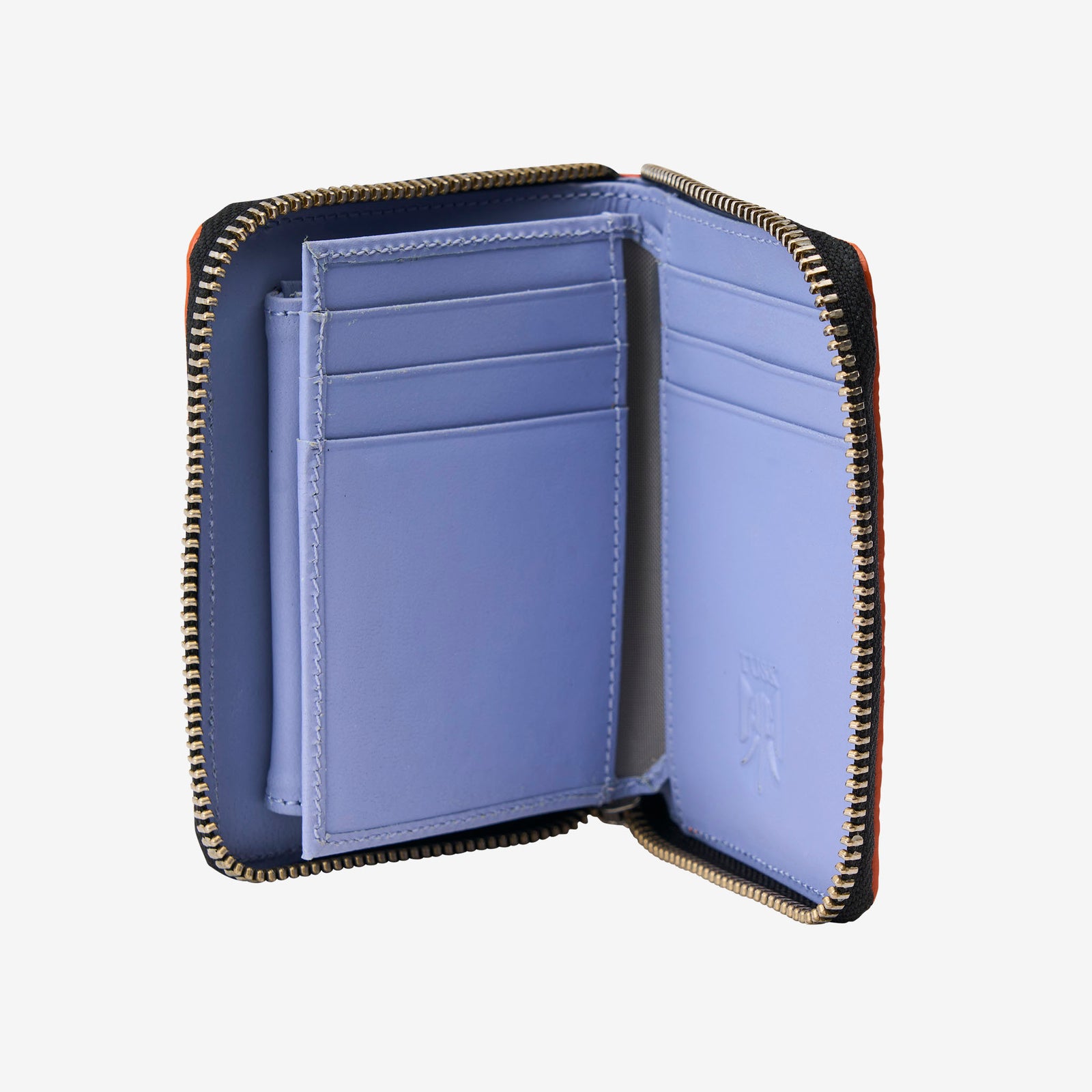 Tusk Amsterdam leather zip-around wallet in chocolate brown pebble leather, featuring a compact design with bright orange contrast stitching and an orange zipper pull tab on a white background - CHOCOLATE