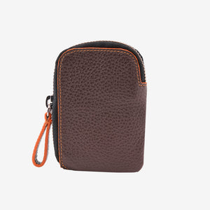 Front view of the Amsterdam Small Zip Card Wallet in Chocolate brown pebbled leather, featuring a contrasting orange stitched border on a curved edge, a black zipper with a silver pull tab, and an attached leather zipper pull - CHOCOLATE